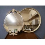 Two white circular mirrors