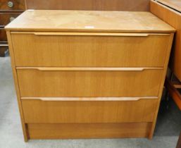 A teak chest of drawers