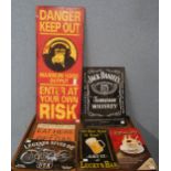 Assorted tin advertising signs