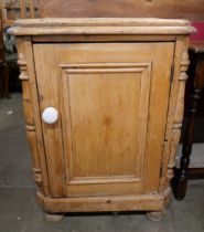 A Victorian pine single door cupboard