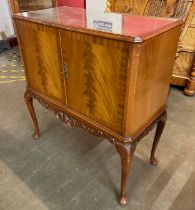 An early 20th century burr walnut cocktail cabinet