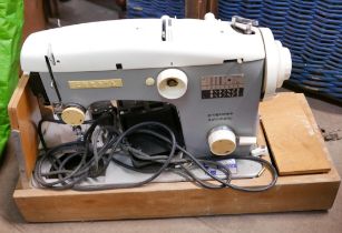 A cased Cresta sewing machine