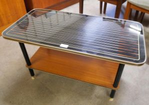 A teak and black laminate Starburst pattern coffee table