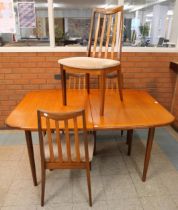 A G-Plan Sierra teak extending dining table and four G-Plan Fresco chairs