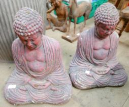 A pair of concrete Buddhas