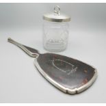 A silver and tortoiseshell hand mirror and a silver topped glass preserve jar, lid 37g
