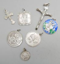 Five silver St. Christopher pendants and two silver crucifix pendants, 25g