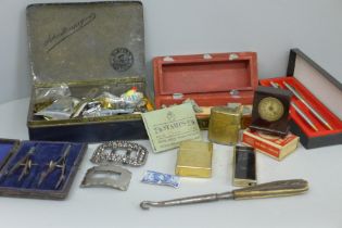 A novelty Bakelite clock read out tape measure, lighters, a travel inkwell, two Georgian buckles,