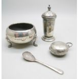 A silver salt and spoon, a silver pepper and a silver sovereign case, 74g, case a/f