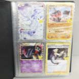 A small album of Pokemon cards
