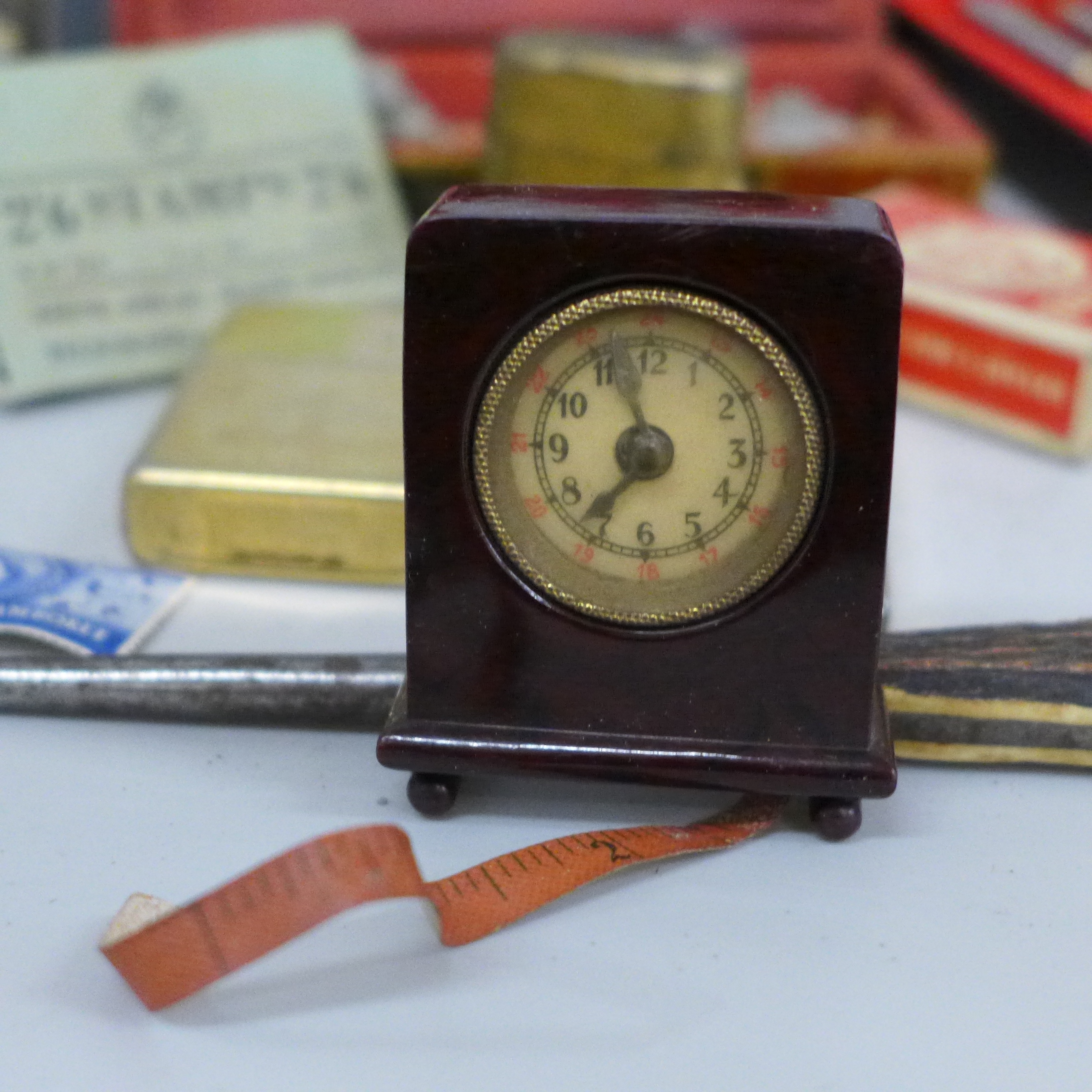 A novelty Bakelite clock read out tape measure, lighters, a travel inkwell, two Georgian buckles, - Image 7 of 7