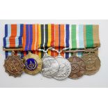 A set of six mounted Rhodesian medals including South African Merit medal, a Pro Patra medal, a