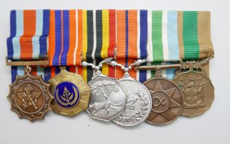 A set of six mounted Rhodesian medals including South African Merit medal, a Pro Patra medal, a