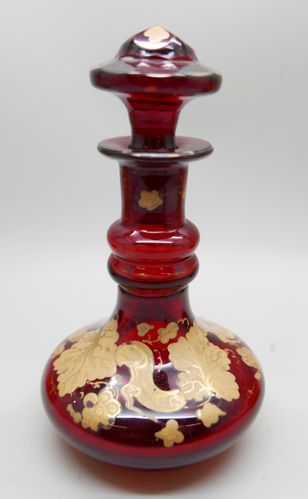 A pair of early 20th Century cranberry glass bottle with lids and gilt detail and a ruby glass scent - Image 2 of 5