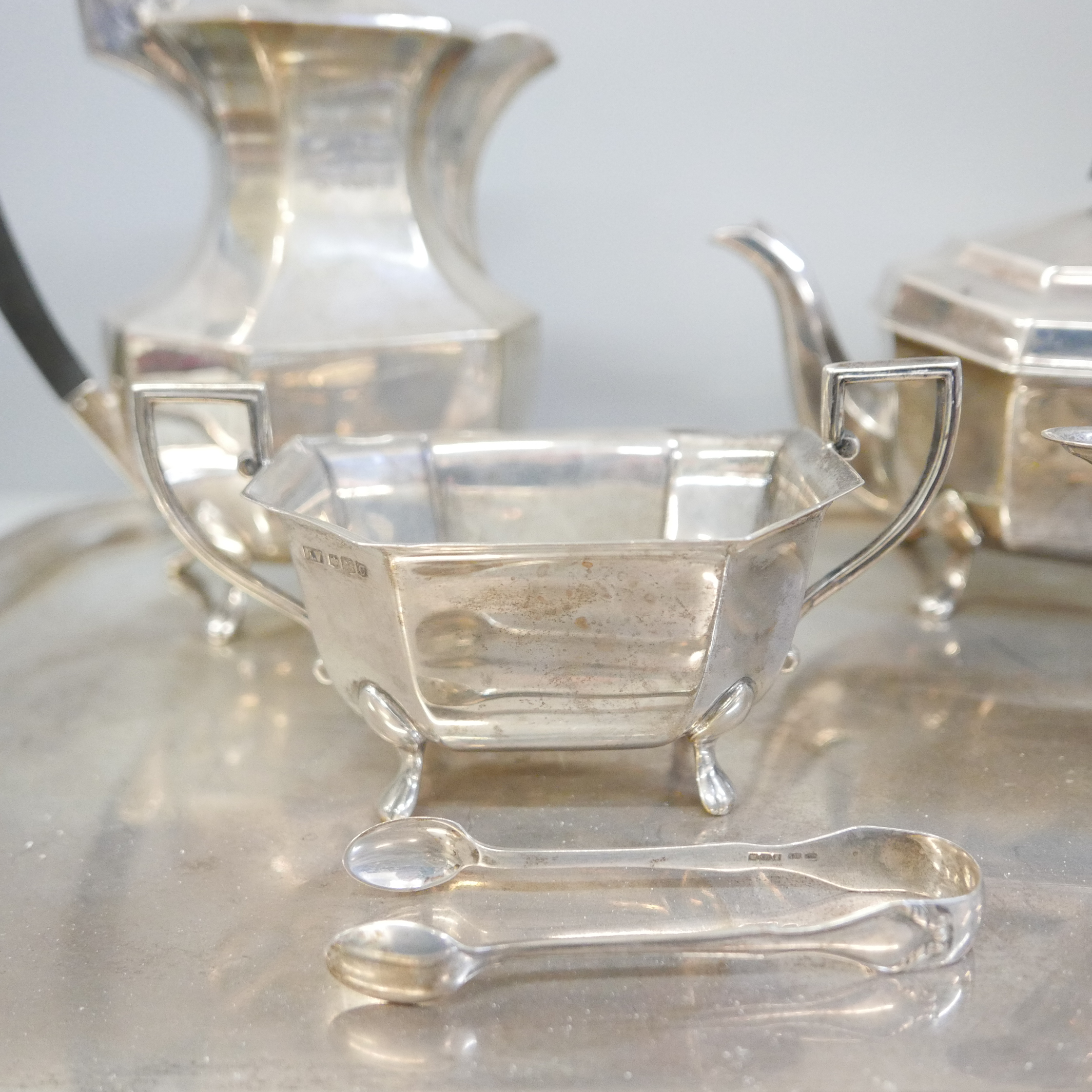 A silver four piece tea service, two handled tray and a pair of silver sugar bows, Sheffield 1945 - Image 6 of 7