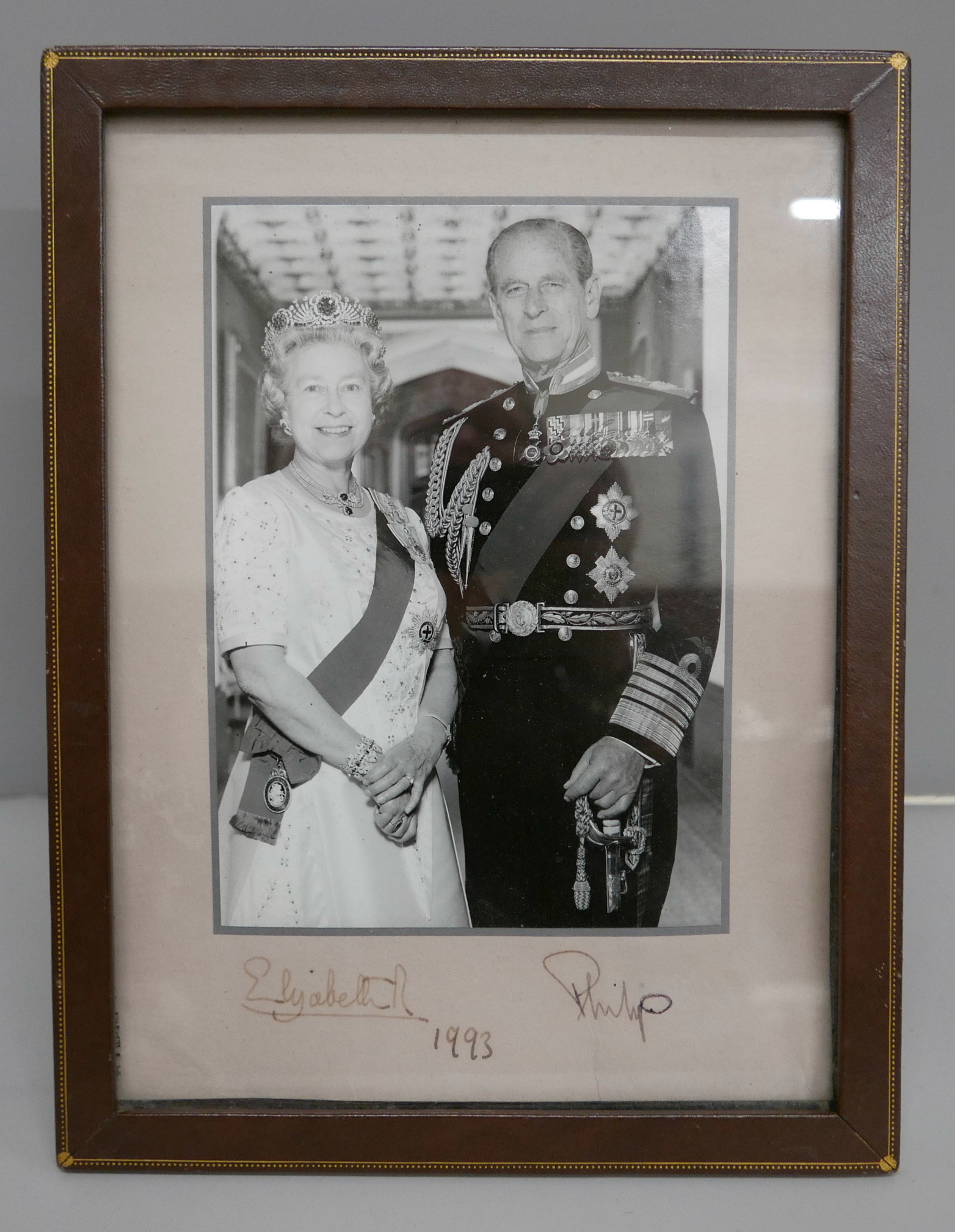 A Queen Elizabeth II and Prince Philip black and white photograph with a leather frame, 1993 - Image 4 of 4