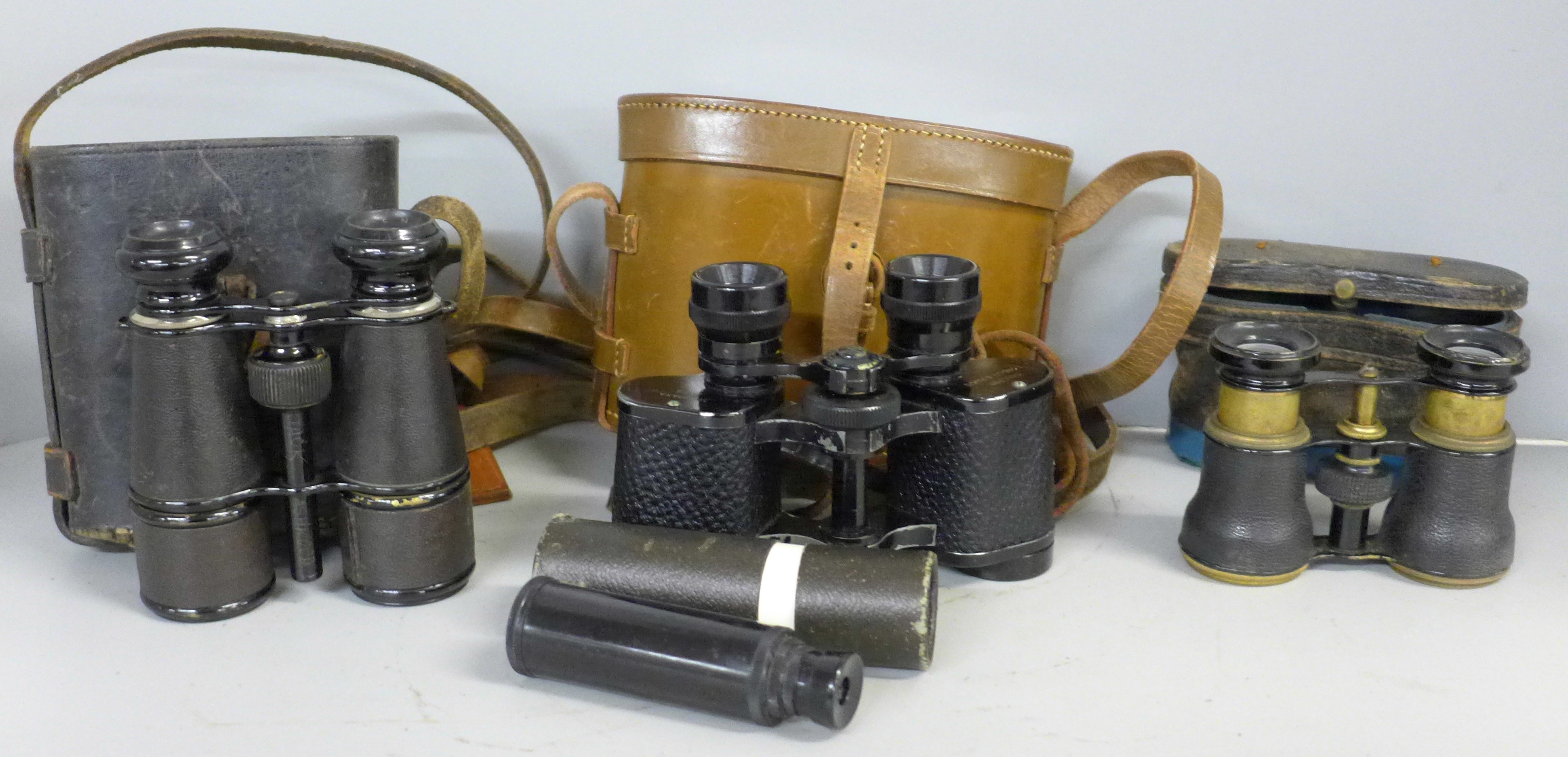 Three cased sets of field glasses and a pocket Zonex telescope
