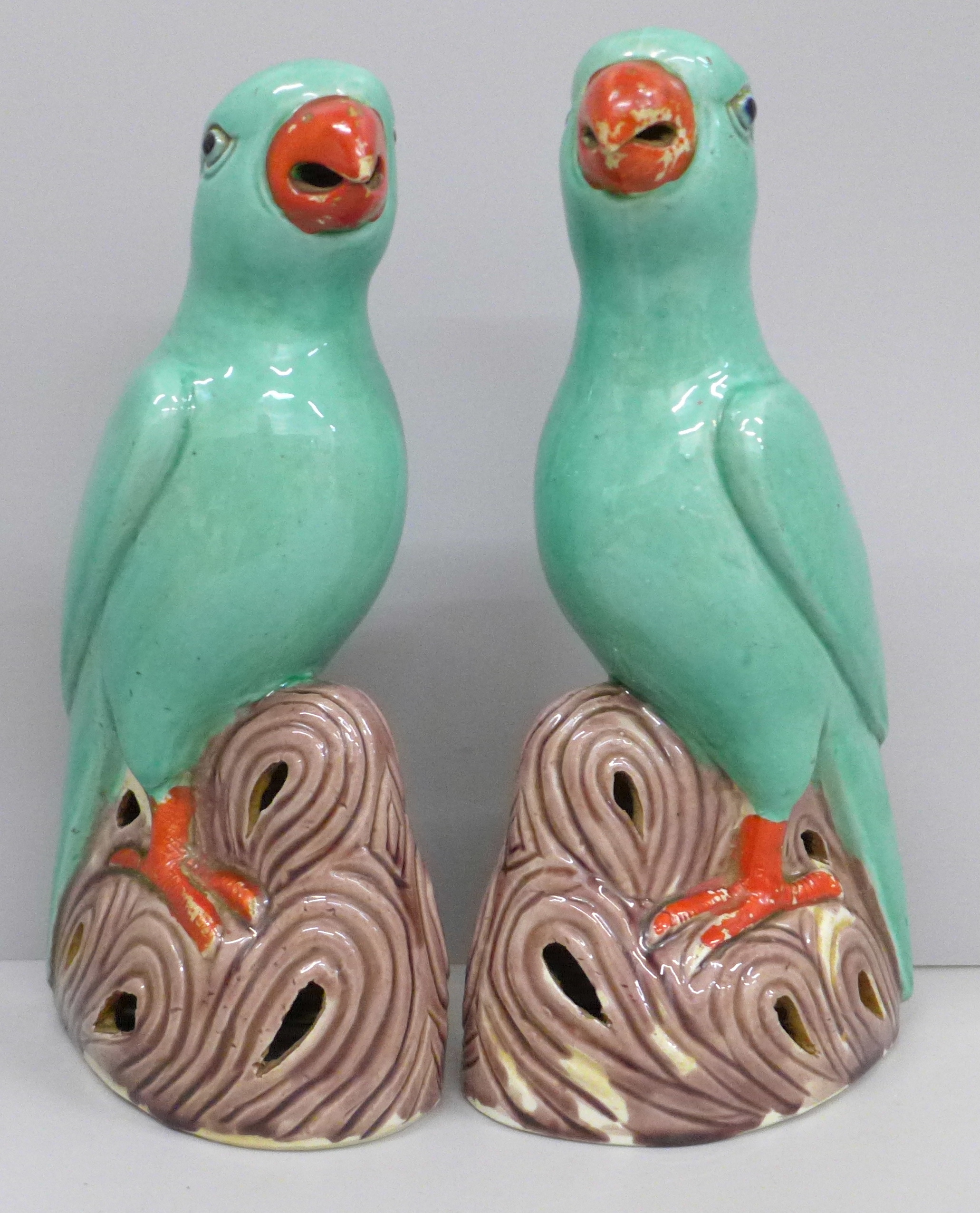 A pair of Chinese polychrome porcelain models of parrots, 22cm