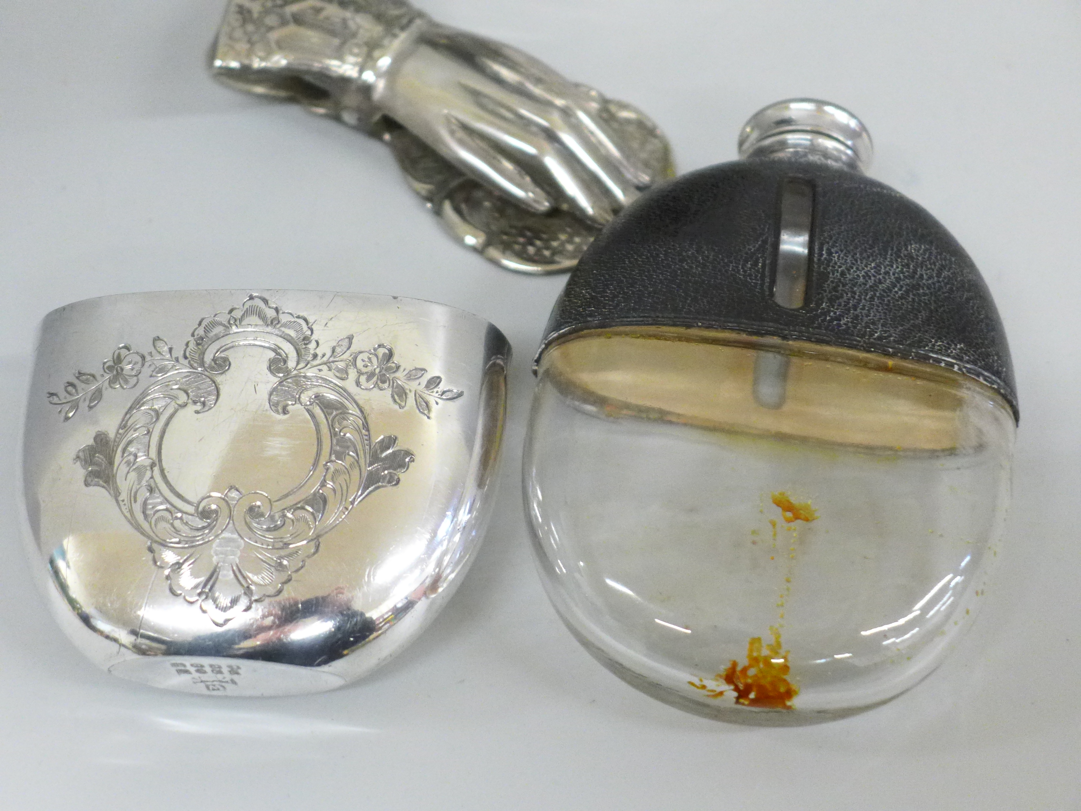 Two similar hip flasks, leather, glass and silver plated cups and a paper clip in the form of a hand - Image 2 of 2