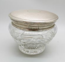 A silver topped cut glass jar, lid 42g, diameter 92mm