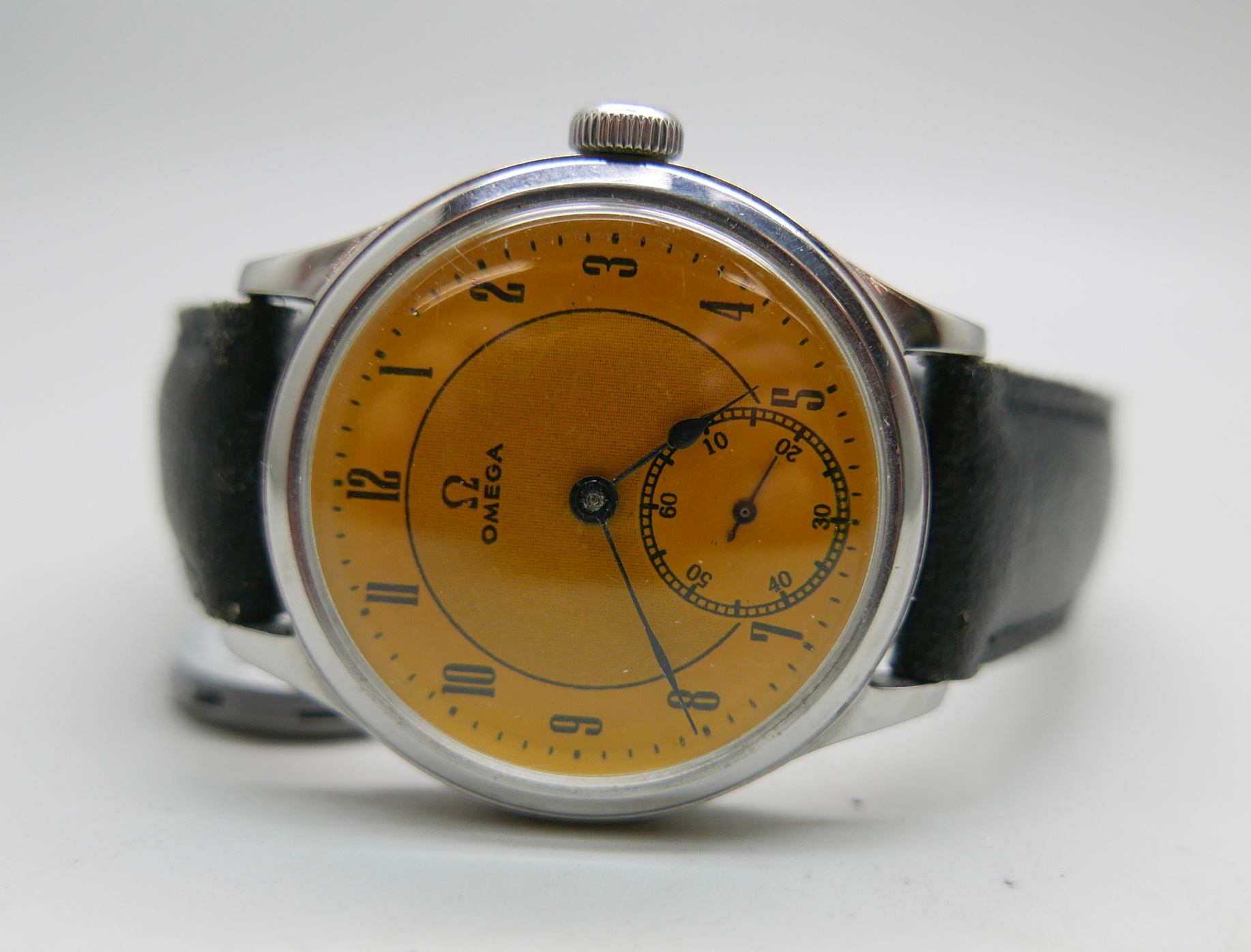 An Omega military style wristwatch with yellow dial, calibre 30T2, same movement in Omega WWII