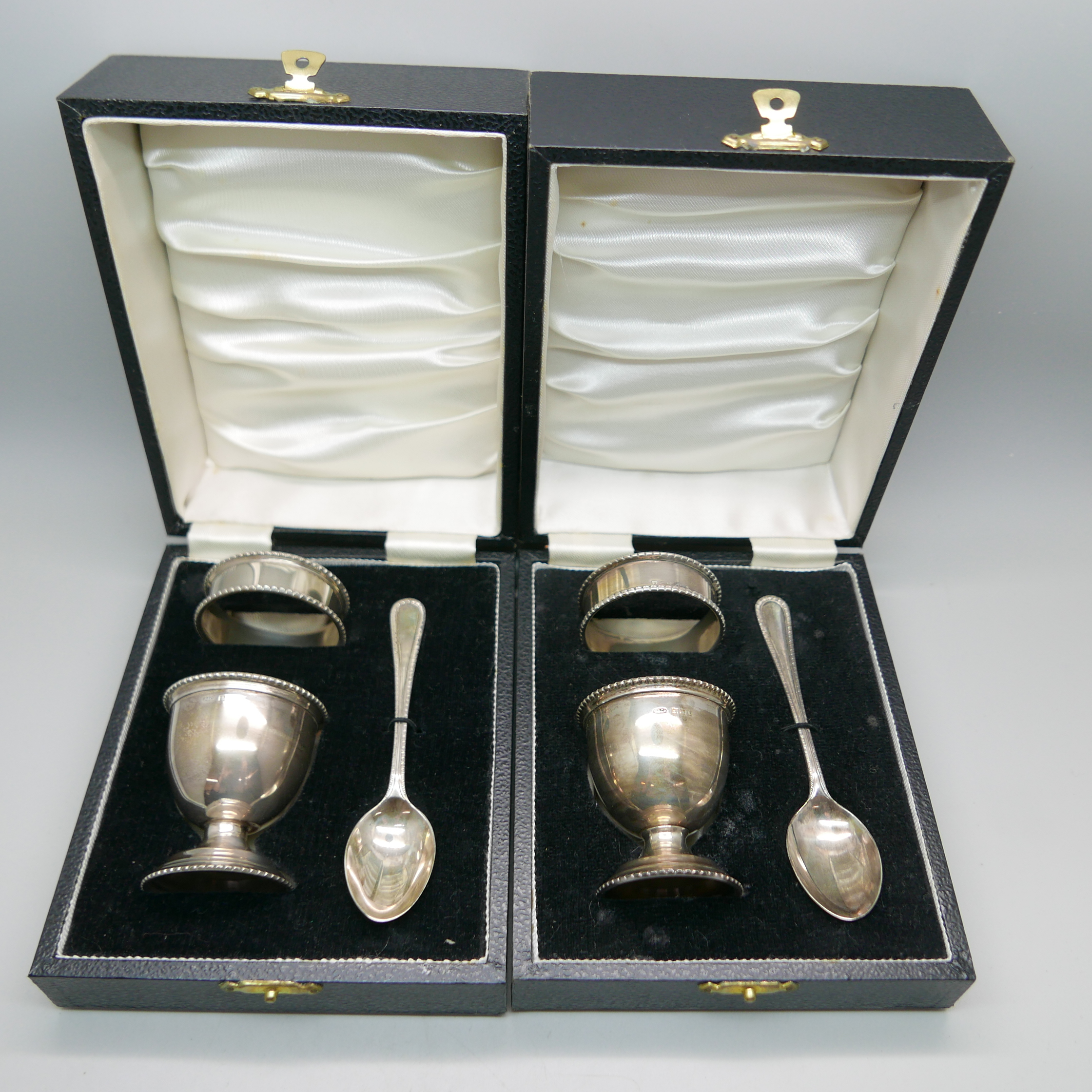 Two silver christening sets, cased, 92g