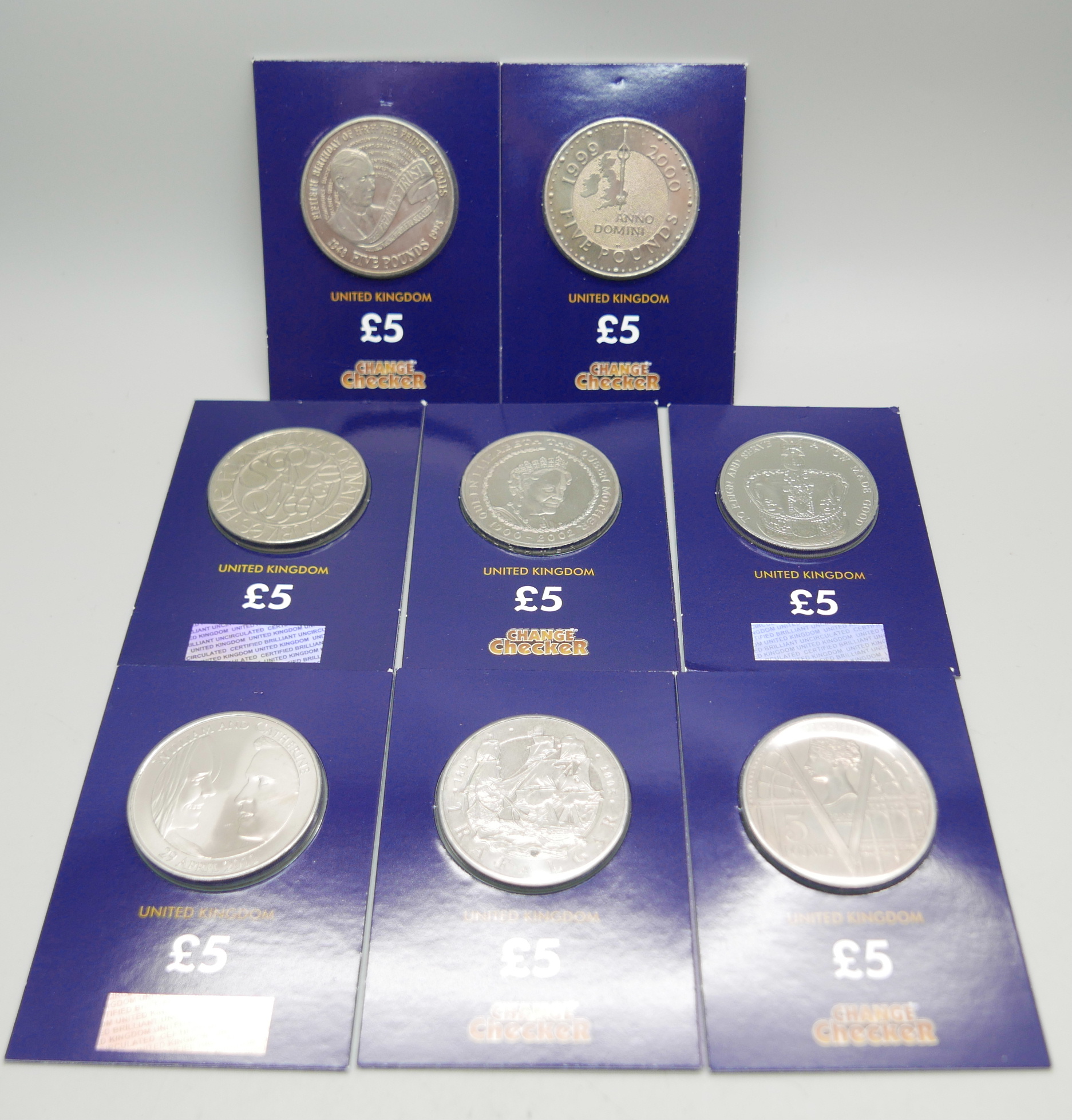 Eight uncirculated £5 coins; 1998, 1999, 2001, 2002, 2003, 2005, 2011, 2013 in sealed packs