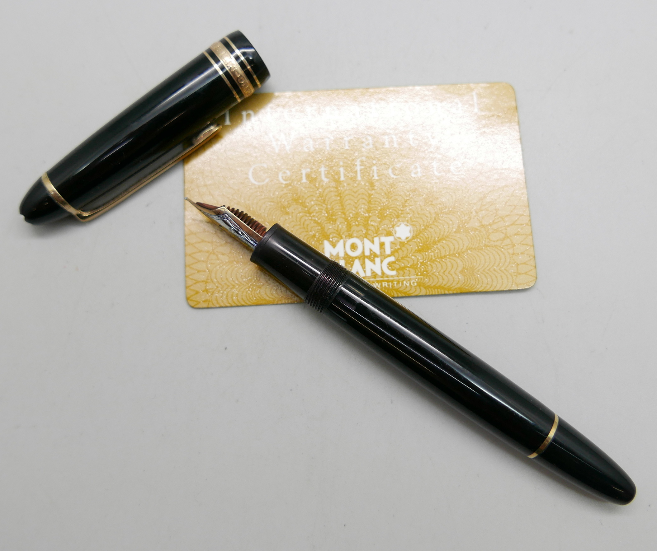 A Montblanc Meisterstuck No.146 fountain pen with 14ct gold nib, EC110011, with a warranty card