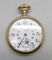 A gold plated Elgin pocket watch with railroad dial, screw back case