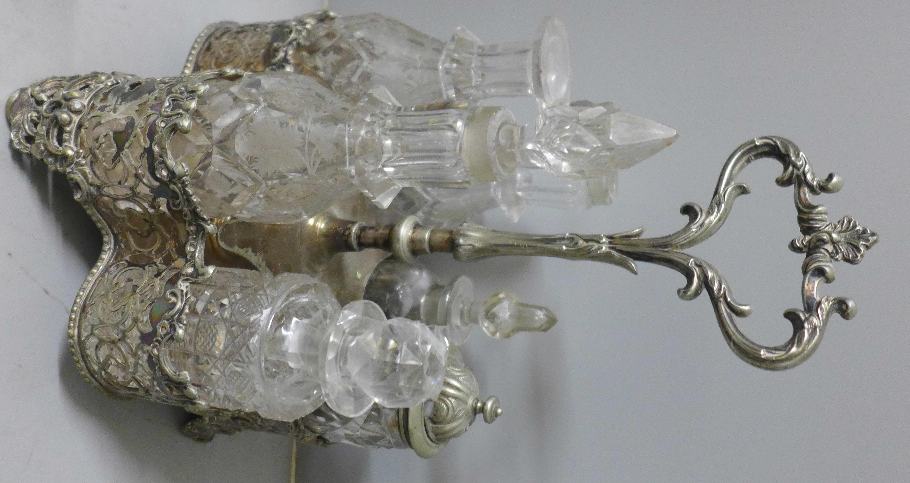Two plated cruet sets, one six bottle with missing glass bottle and an ornate six bottle cruet set - Image 3 of 3