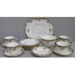 A Beswick & Sons 4494 pattern part tea service comprising cake plate, six side plates and saucers,