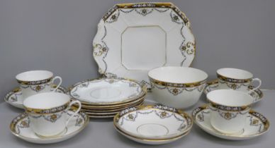A Beswick & Sons 4494 pattern part tea service comprising cake plate, six side plates and saucers,