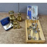 A collection of collectors spoons and a set of brass weights plus a gold plated brooch **PLEASE NOTE
