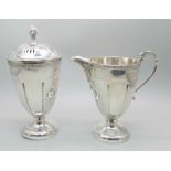 A silver cream jug and a matching sugar shaker by Adie Bros., Birmingham 1935, 207g, (both bases a/