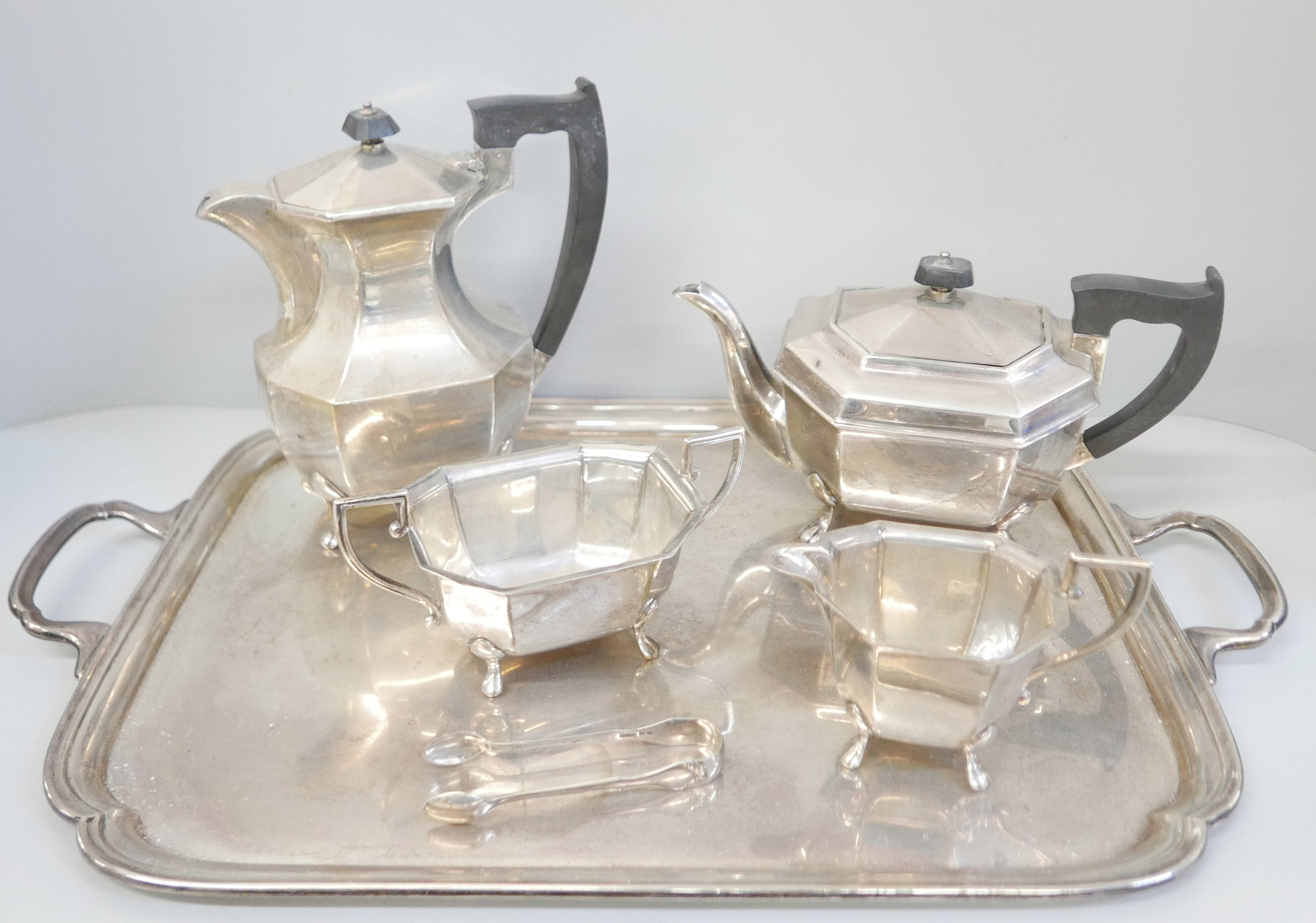 A silver four piece tea service, two handled tray and a pair of silver sugar bows, Sheffield 1945