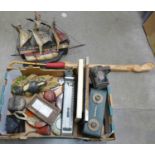 A box of assorted items, surveyor's tape measures, railway lamp, woodpecker figure, lady's umbrella,