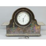 A silver plated mantel clock with French movement, 32cm wide, with key