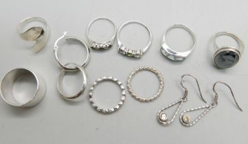 Eight silver rings and two pairs of silver earrings (all test as silver)