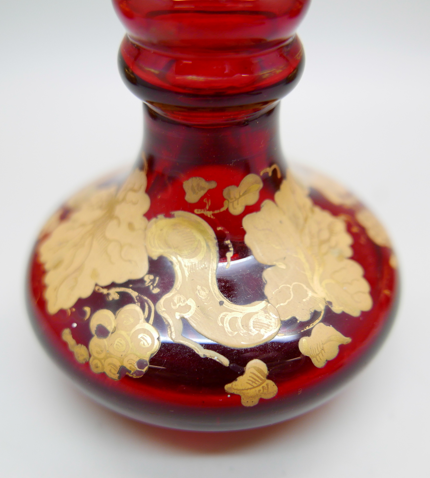 A pair of early 20th Century cranberry glass bottle with lids and gilt detail and a ruby glass scent - Image 3 of 5