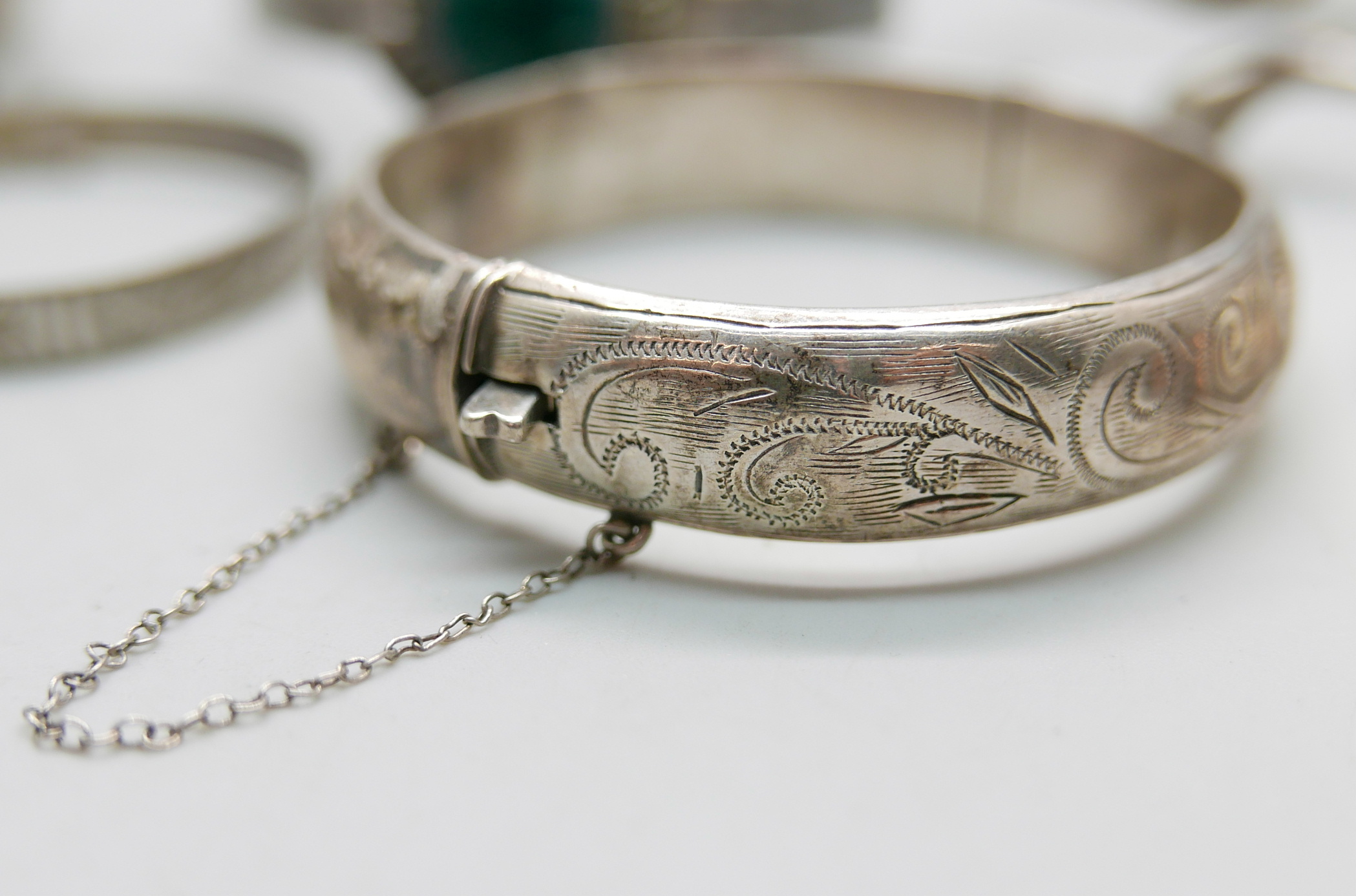 Six silver bangles and a silver napkin ring, 158g - Image 2 of 3