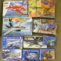 A collection of model aircraft and motor car kits, Revell, Airfix, and Monogram, etc.