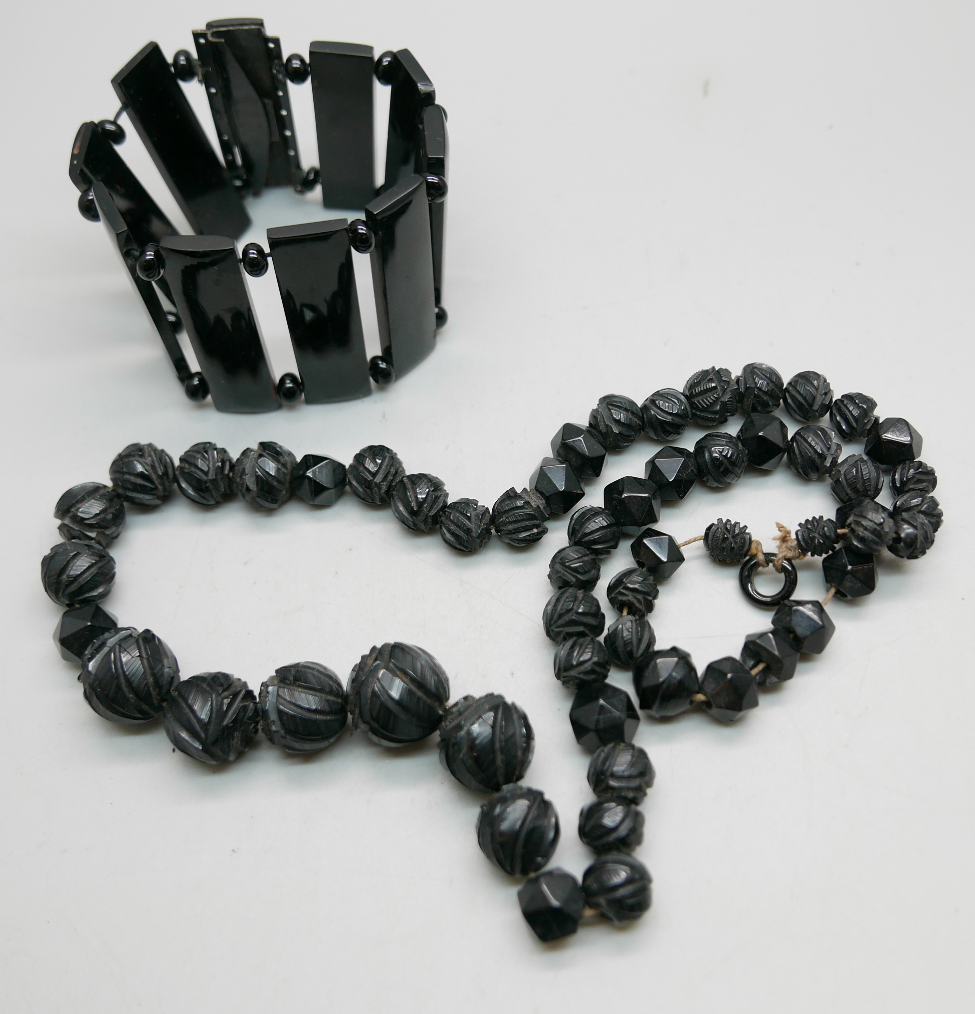 A carved jet necklace and bracelet - Image 2 of 3