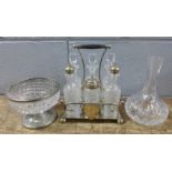 A silver plated six bottle cruet stand with six glass condiments, a cut glass posy vase and a