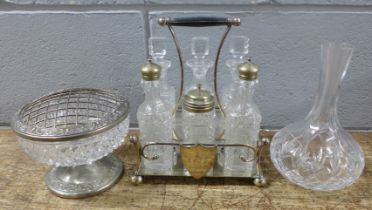 A silver plated six bottle cruet stand with six glass condiments, a cut glass posy vase and a