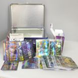 Two packets of Pokemon Pocket Monster cards and a Pokemon tin