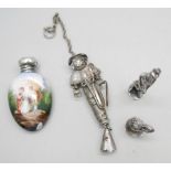 An enamel and silver topped scent bottle, a/f, two hallmarked silver models, a gentleman and a