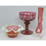 A cranberry and white Kralik Thorn vase, a ruffle edge cranberry glass bowl and a cranberry cut