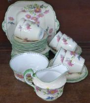 An Aynsley hand painted floral part tea set, four cups a/f