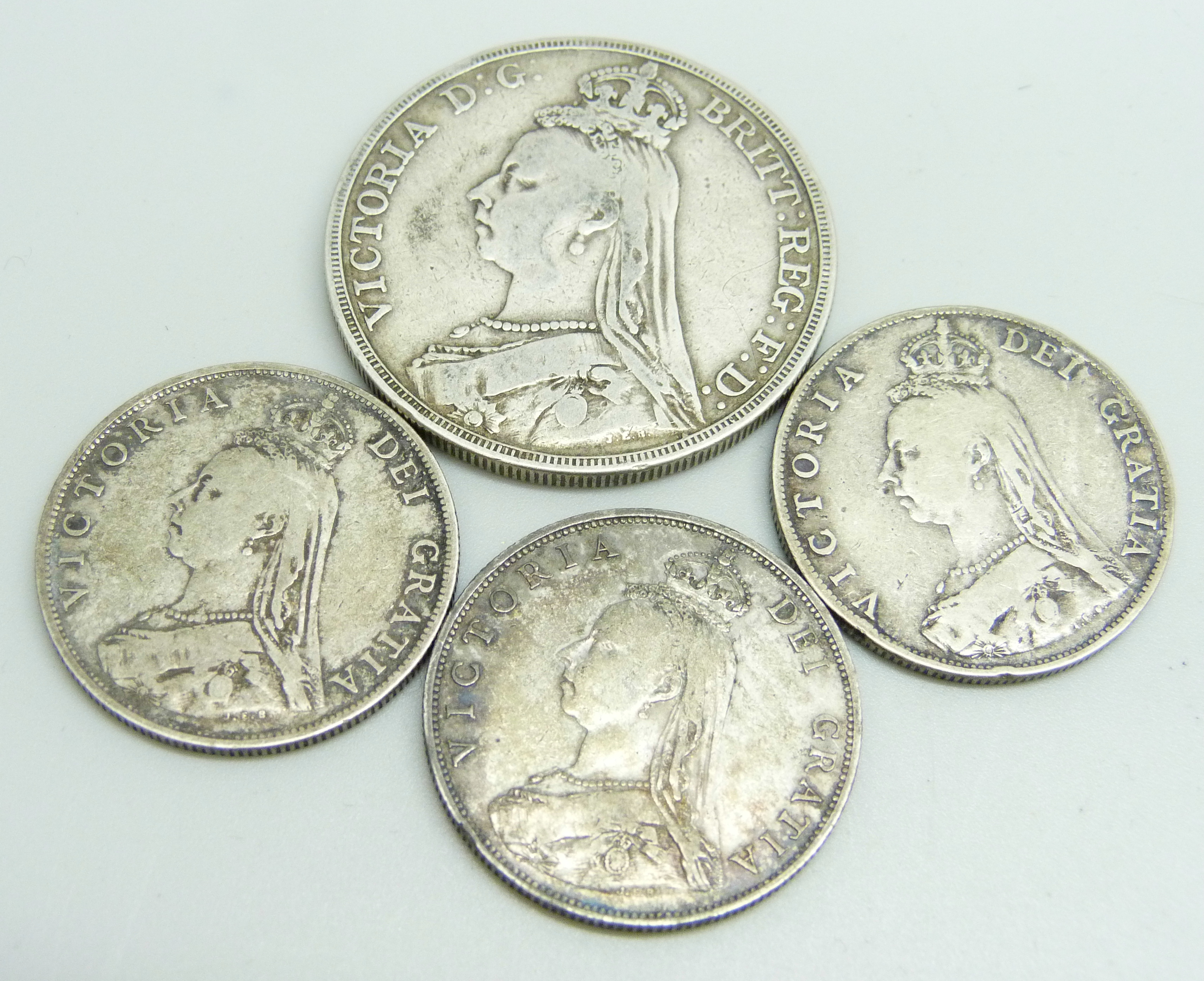 An 1889 silver crown and three 1887 silver florins, 61.3g