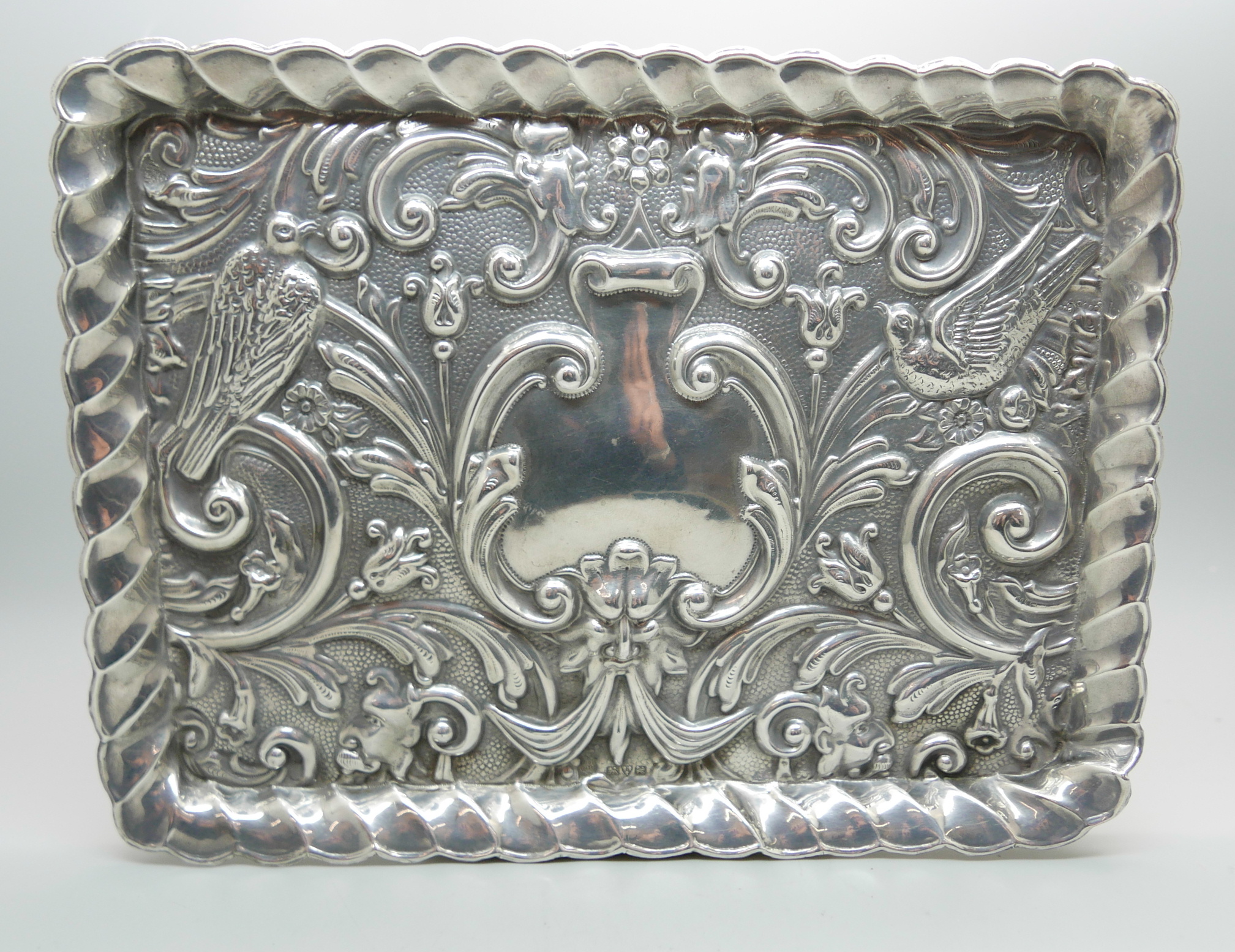 An embossed silver tray, Chester 1908, 163g, 17.5cm x 23cm